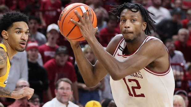 Razorbacks Tramon Mark drives against UNC-Greensboro last Friday night